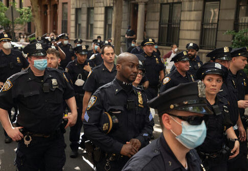 Police officers gathered on a city street