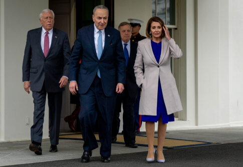 Group of political leaders walking outside the White House